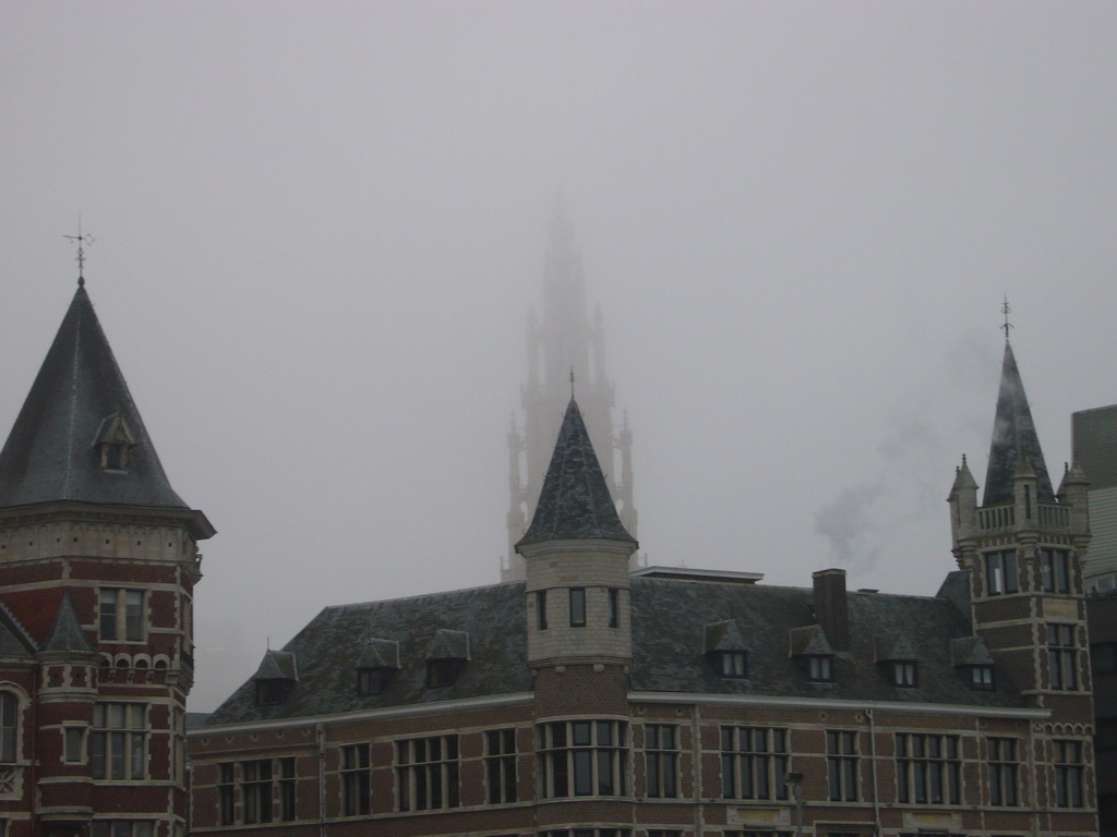 Buildings at the Jordaenskaai street and the tower of the Cathedral of Our Lady, viewed from the shore of the Scheldt river at the north side of the Het Steen castle