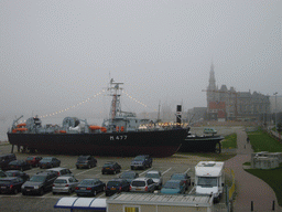 Ship and the Pilotage Building at the shore of the Scheldt river at the north side of the Het Steen castle