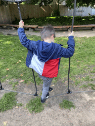 Max on a rope bridge at the Lion`s Path playground at the Antwerp Zoo