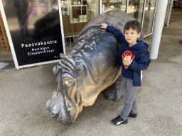 Max with a Hippopotamus statue in front of the souvenir shop at the Antwerp Zoo