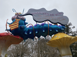 Decoration `The Caterpillar`s Advice` of the Alice in Wonderland Light Festival at the Antwerp Zoo, with explanation