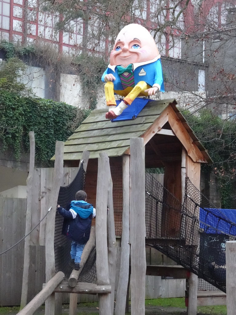 Max and a decoration of the Alice in Wonderland Light Festival at the Lion`s Path playground at the Antwerp Zoo