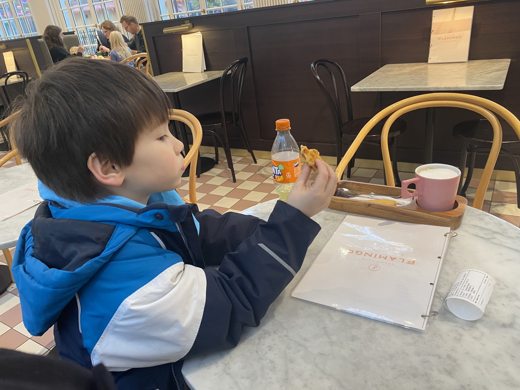 Max eating a waffle at the Grand Café Flamingo at the Antwerp Zoo