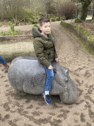 Max on a Hippopotamus statue at the Antwerp Zoo