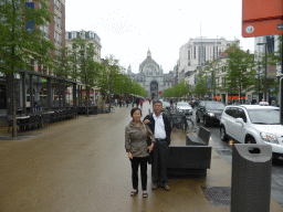 Miaomiao`s parents at the Keyserlei street and the west side of the Antwerp Central Railway Station