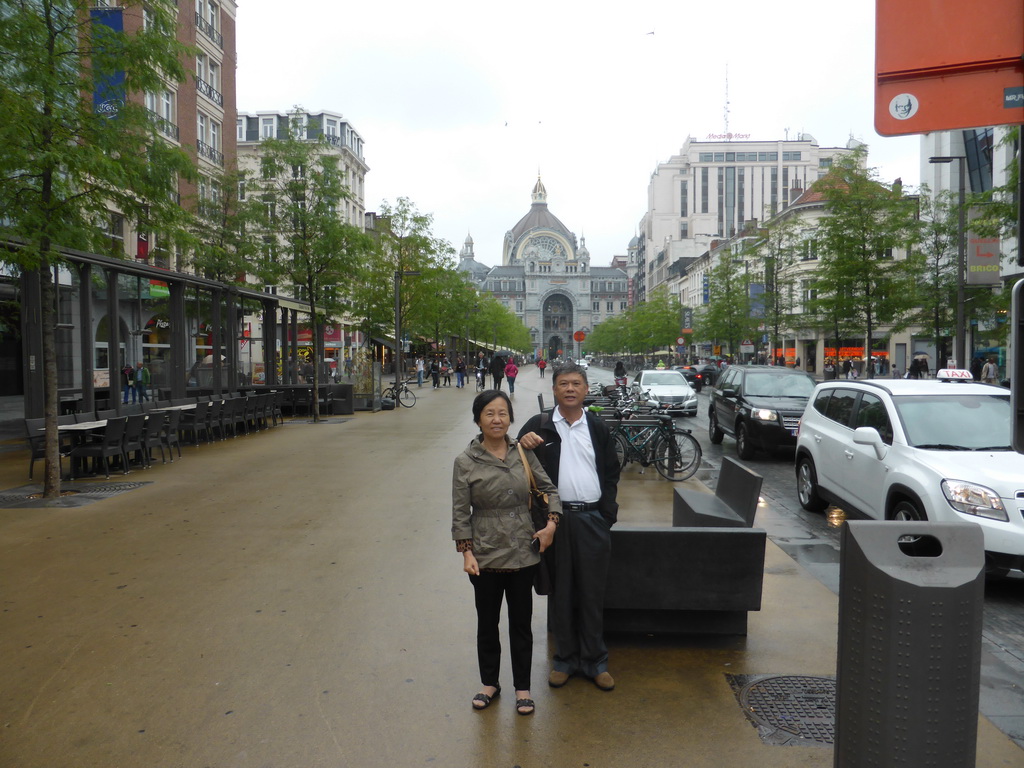 Miaomiao`s parents at the Keyserlei street and the west side of the Antwerp Central Railway Station