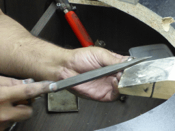 Man working on a diamond ring in the workshop of the Gela diamond shop at the Pelikaanstraat street