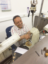 Man inscribing text into a diamond ring in the workshop of the Gela diamond shop at the Pelikaanstraat street