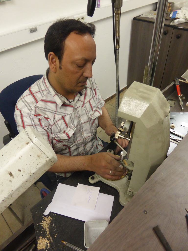 Man inscribing text into a diamond ring in the workshop of the Gela diamond shop at the Pelikaanstraat street