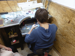 Man working on a diamond ring in the workshop of the Gela diamond shop at the Pelikaanstraat street