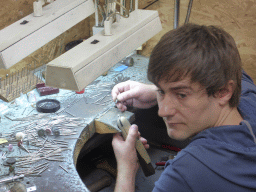 Man working on a diamond ring in the workshop of the Gela diamond shop at the Pelikaanstraat street