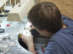 Man polishing a diamond ring in the workshop of the Gela diamond shop at the Pelikaanstraat street