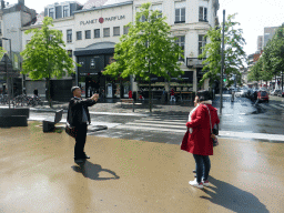 Miaomiao and her parents taking a picture at the Keyserlei street