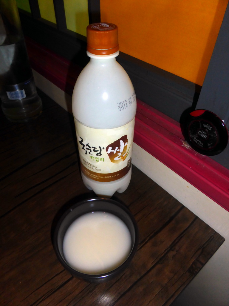 Bottle and bowl with Korean rice wine at the Korean Barbeque restaurant Arirang