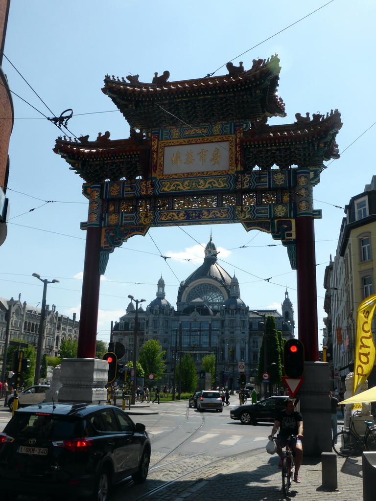 Chinatown Gate at the south side of the Van Wesenbekestraat street, and the front of the Antwerp Central Railway Station at the Koningin Astridplein square