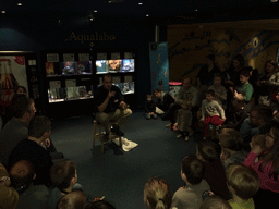 Zookeeper with a snake at the Aqualabo at the Aquatopia aquarium