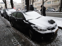Our car covered in snow and Orthodox Jews at the Charlottalei street