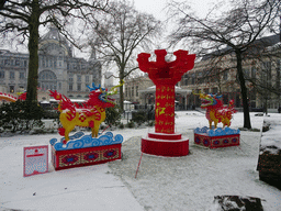 China Light Lion statues at the Antwerp Zoo, with a view on the northeast side of the Antwerpen-Centraal railway station