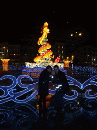 Tim, Miaomiao and Max at the China Light Dragon statue at the Koningin Astridplein square, by night