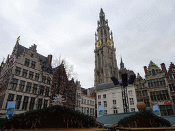 Christmas stalls at the Grote Markt square and the tower of the Cathedral of Our Lady
