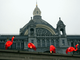 China Light Flamingo statues at the Antwerp Zoo and the east side of the Antwerpen-Centraal railway station, at sunset