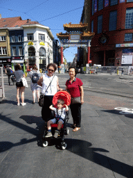 Miaomiao, Max and Miaomiao`s mother in front of the Chinatown Gate at the Koningin Astridplein square