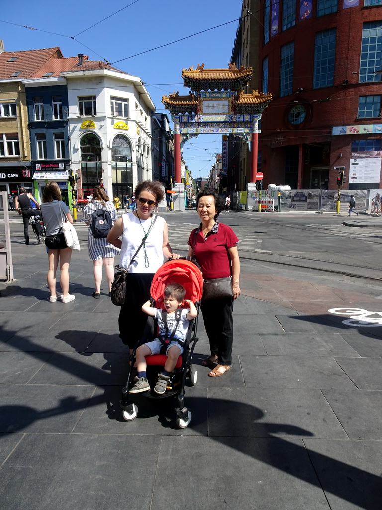 Miaomiao, Max and Miaomiao`s mother in front of the Chinatown Gate at the Koningin Astridplein square