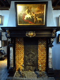 Hearth and painting `The Holy Family with John the Baptist` by Gerard Seghers at the First Floor of the Rubens House