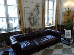 Sofa and statue at the Ground Floor of the Left Wing of the Paleis op de Meir palace