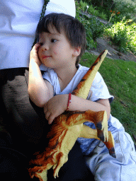 Max with a dinosaur toy at the Den Botaniek botanical garden