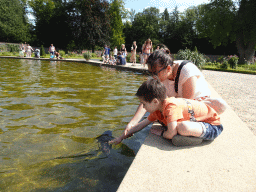 Miaomiao and Max with a Carp in the pond with the fountain at the north side of the Palace Garden of Het Loo Palace