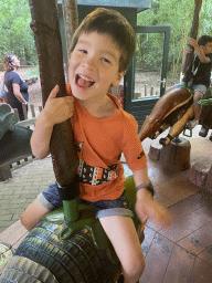 Max on the carousel at the playground near the exit of the Apenheul zoo