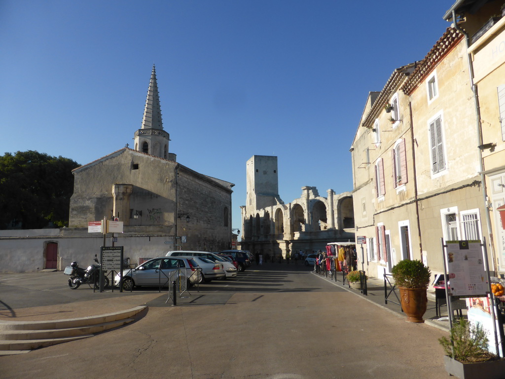 The Rue Porte de Laure street with the south side of the Collège Saint Charles building and the Arles Amphitheatre