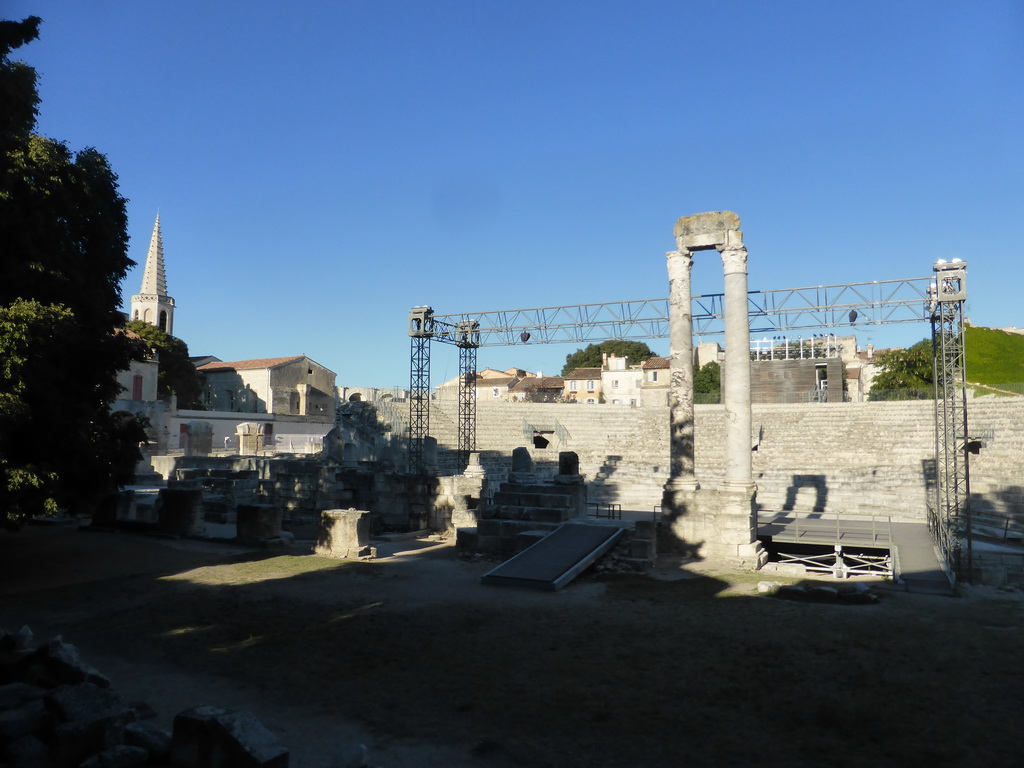 West side of the Ancient Theatre of Arles and the tower of the Collège Saint Charles building, viewed from the Rue du Cloître street