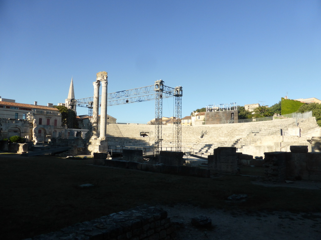 Southwest side of the Ancient Theatre of Arles and the tower of the Collège Saint Charles building, viewed from the Rue du Cloître street