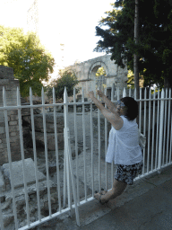 Miaomiao at a fence at the southwest side of the Ancient Theatre of Arles at the Rue du Cloître street