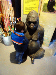 Max with a Gorilla statue at the souvenir shop at the entrance to Burgers` Zoo