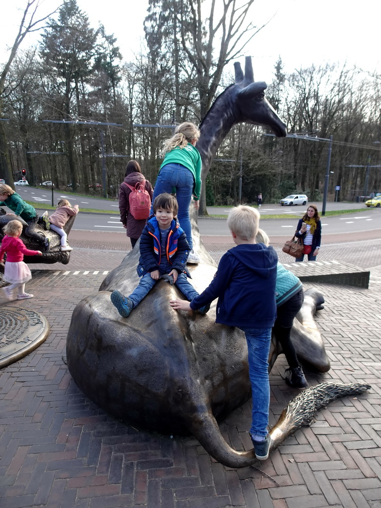 Max with a Giraffe statue at the entrance to Burgers` Zoo