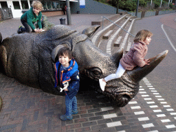 Max with a Rhinoceros statue at the entrance to Burgers` Zoo