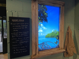 Screen and sign with ranger news at the entrance of the Mangrove Hall of Burgers` Zoo