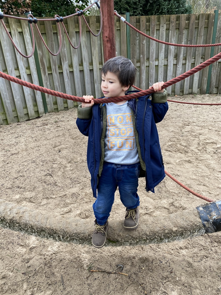 Max at the playground inbetween the Bush Hall and the Desert Hall of Burgers` Zoo