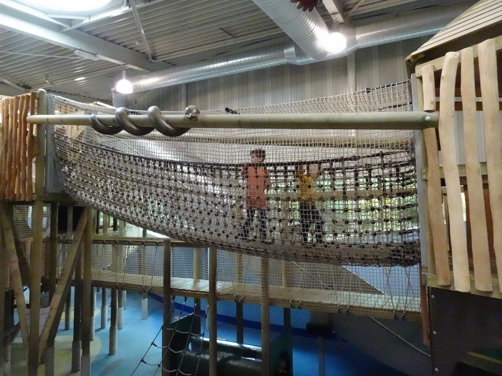 Max on a rope bridge at the Kids Jungle playground at the Park Area of Burgers` Zoo