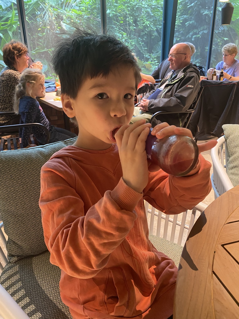 Max having a drink at the terrace of the Bush Restaurant at the Bush Hall of Burgers` Zoo