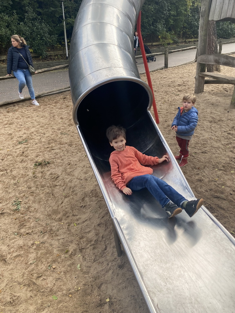 Max on a slide at the playground inbetween the Bush Hall and the Desert Hall of Burgers` Zoo