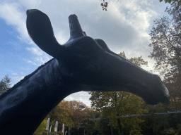 Head of the Giraffe statue at the entrance to Burgers` Zoo at the Antoon van Hooffplein square