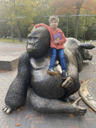 Max on the Gorilla statue at the entrance to Burgers` Zoo at the Antoon van Hooffplein square