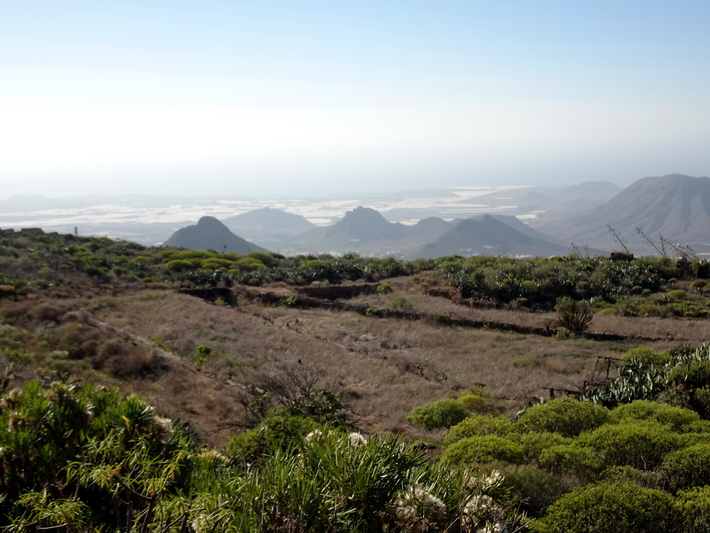 Mountains, hills and greenhouses on the south side of the island, viewed from a parking place next to the Calle Camino-Real street