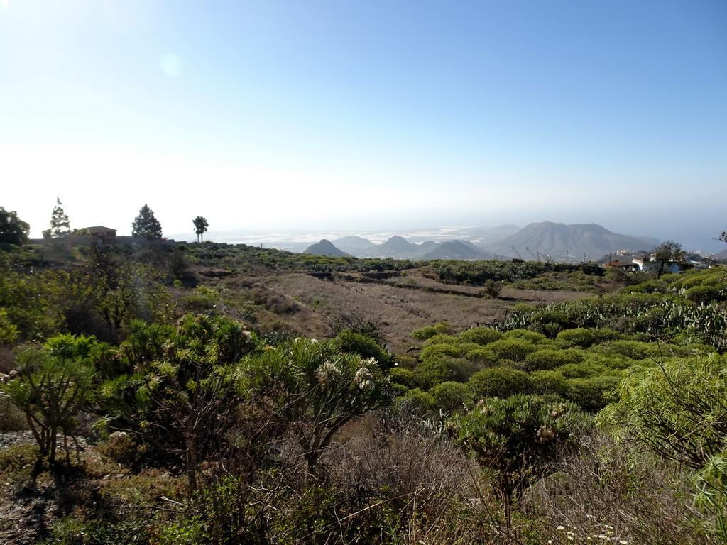 Mountains, hills and greenhouses on the south side of the island, viewed from a parking place next to the Calle Camino-Real street