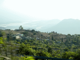 Mountains, hills and greenhouses on the south side of the island, viewed from the rental car on the TF-51 road just southwest of the town of La Escalona
