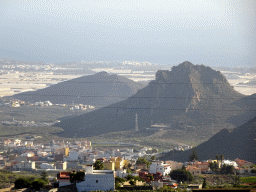 Mountains, hills and greenhouses on the south side of the island, viewed from a parking lot along the TF-51 at the south side of town